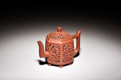 YIXING ZISHA OPENWORK CARVED 'FLOWERS' HEXAGONAL TEAPOT