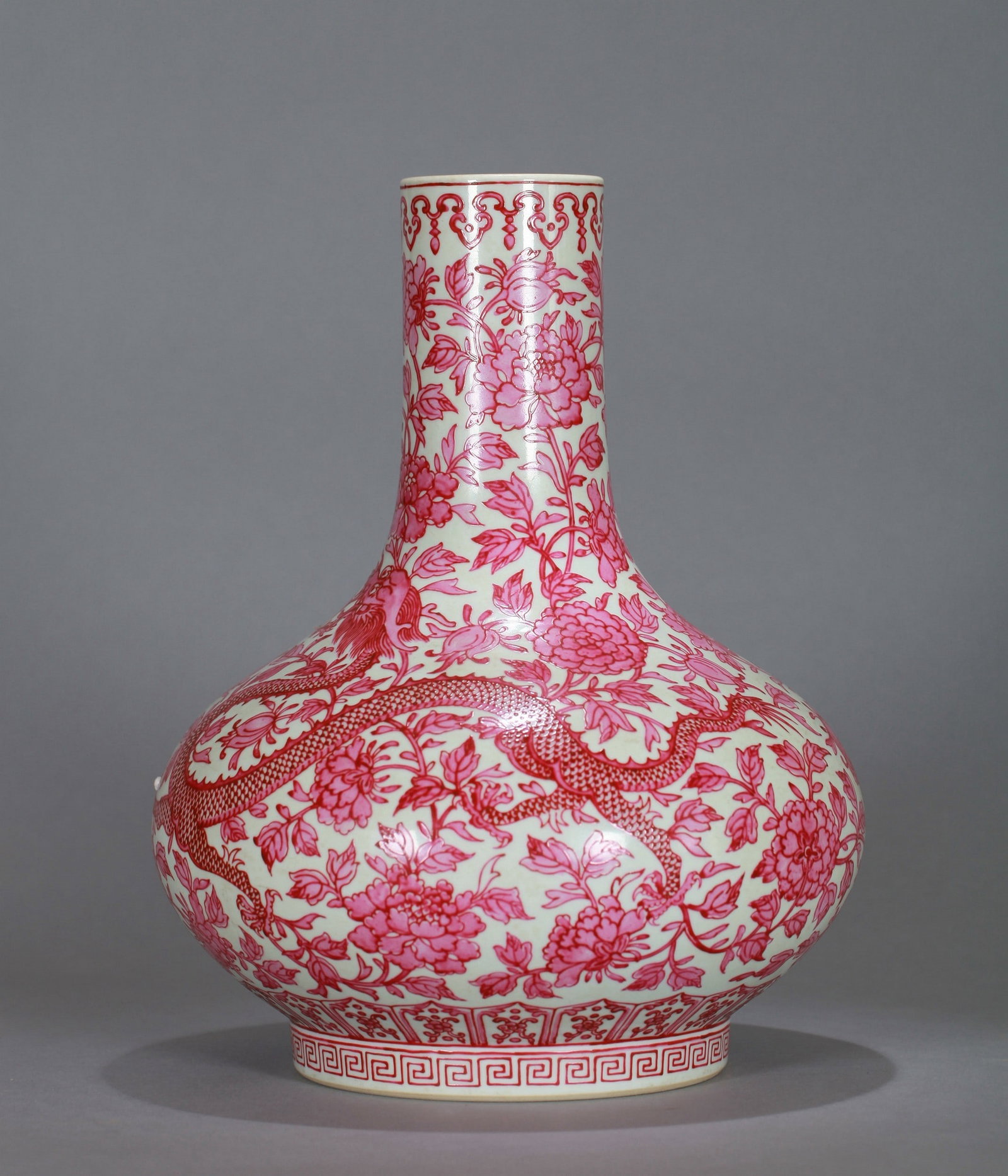 A RED PORCELAIN BOTTLE WITH DRAGON AND PHOENIX PATTERNS: 清光绪 胭脂彩龙凤纹荸荠瓶 A red porcelain bottle with dragon and phoenix patterns Ht：30cm