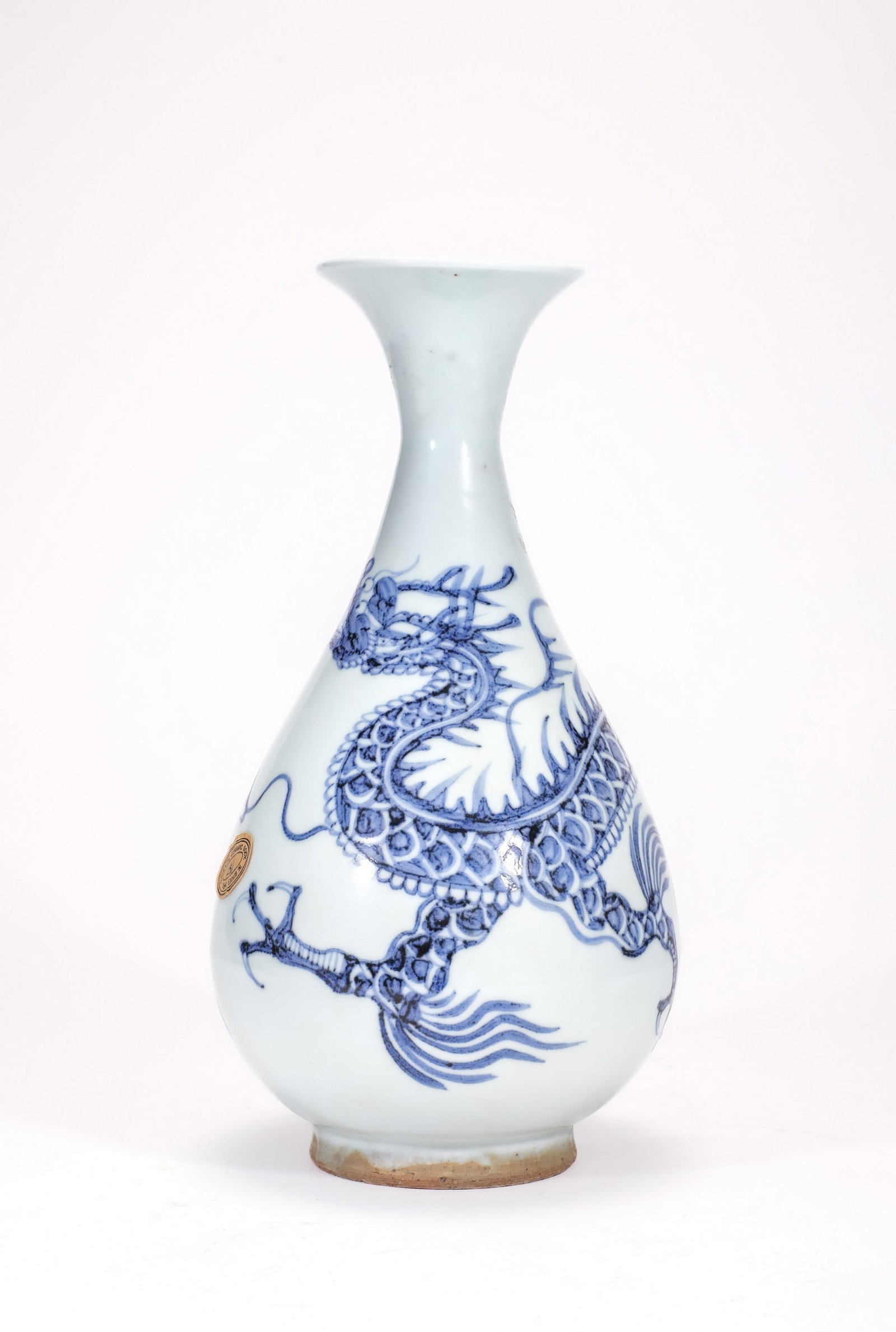 A BLUE AND WHITE DRAGON VASE: 元青花龙纹玉壶春瓶 A blue and white dragon vase Ht.28cm