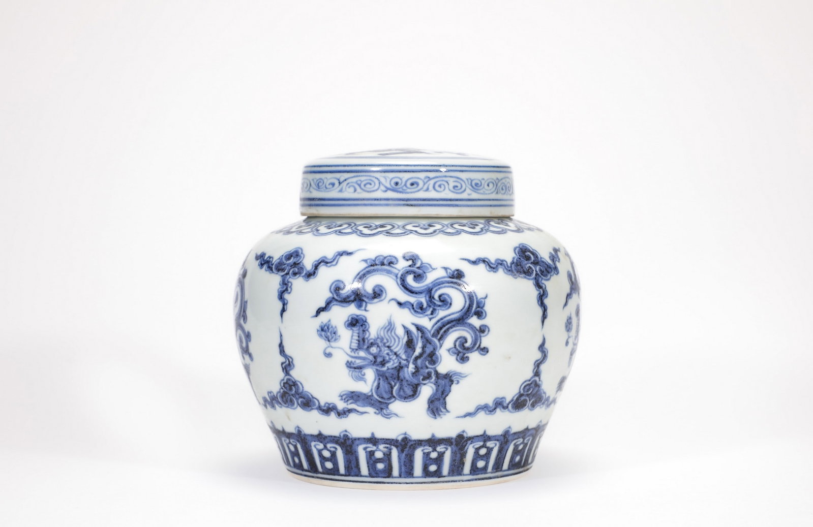 A BLUE AND WHITE DRAGON COVERED JAR (1 of 6)