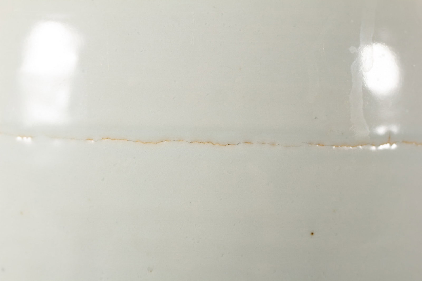 A WHITE GLAZED JAR - 2
