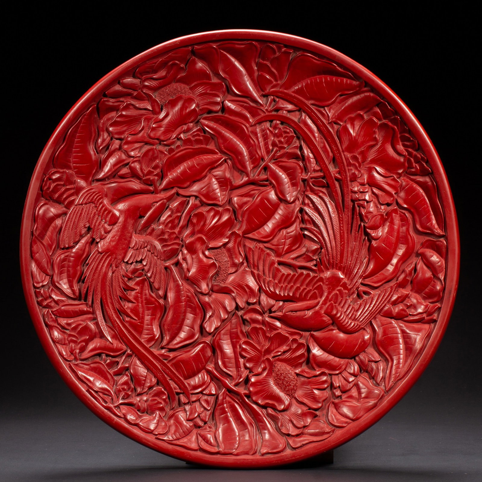 A CARVED CINNABAR LACQUER FLORAL DISH (1 of 9)