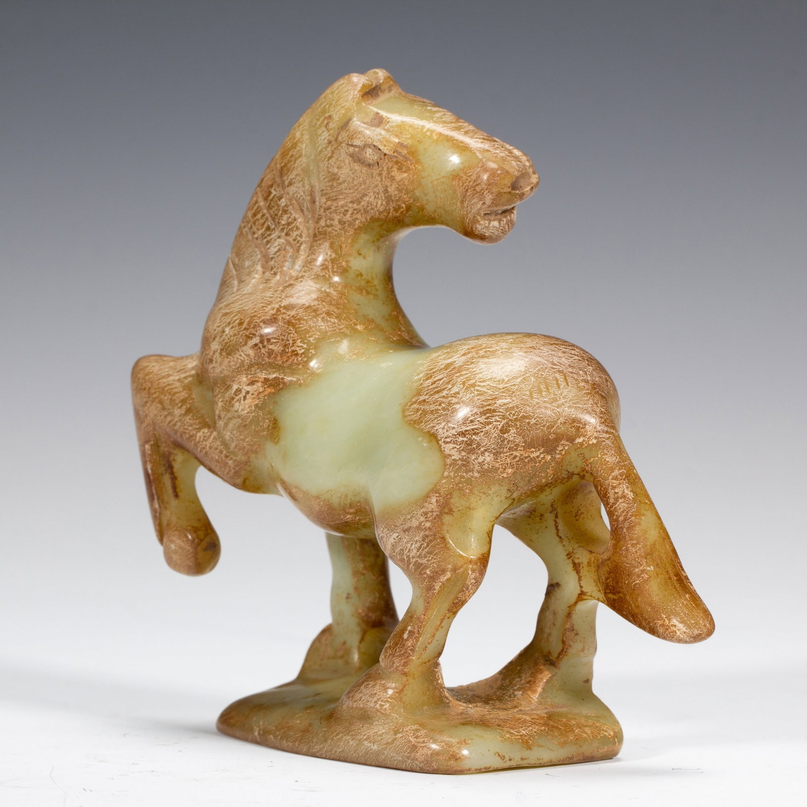 A JADE HORSE: 高古玉马 A jade horse Ht.11CM