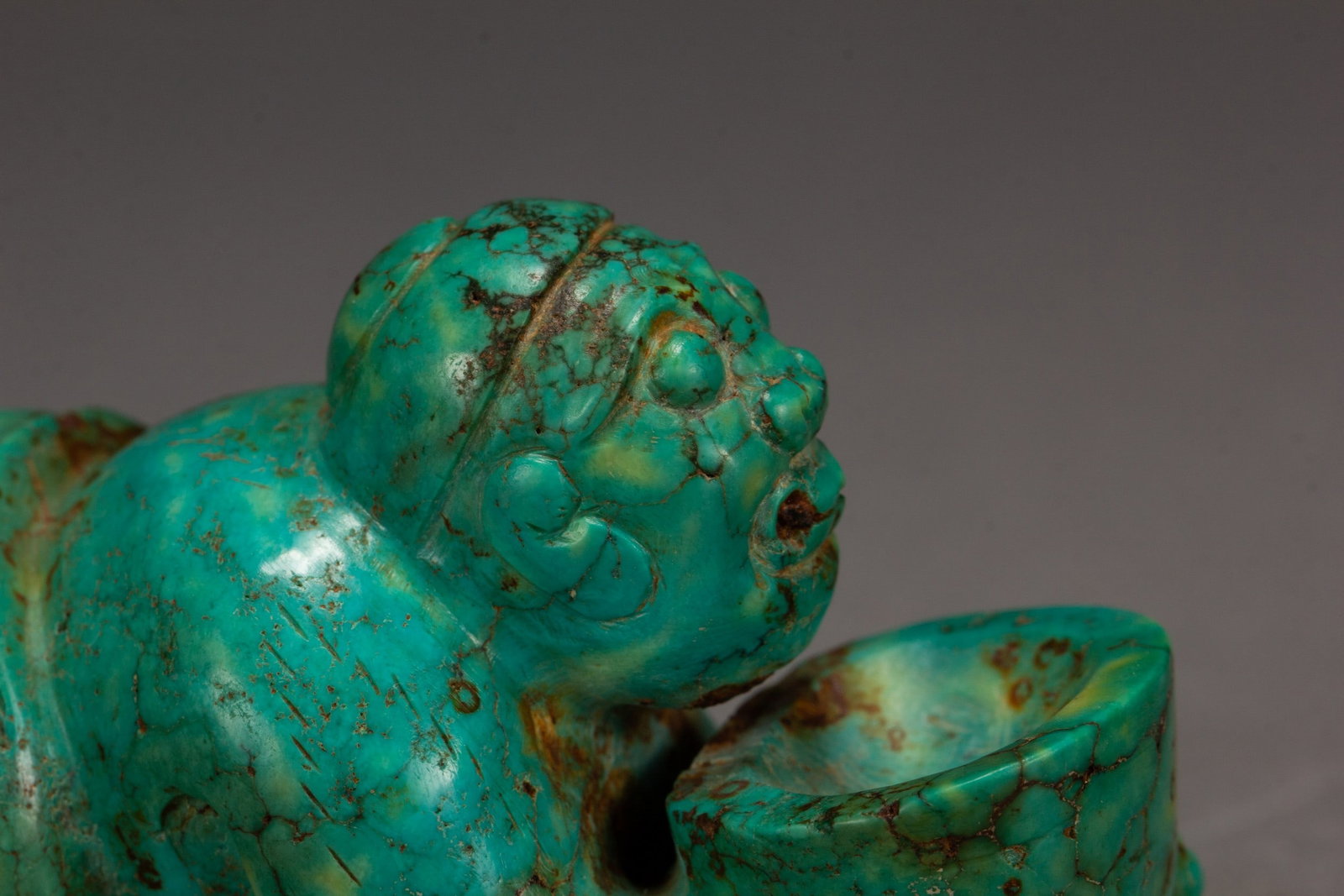 A TURQUOISE FIGURE - 7
