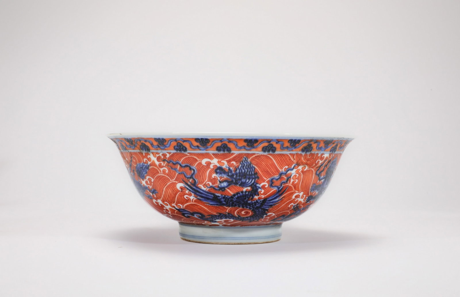 A BLUE AND WHITE IRON-RED SEA BEAST BOWL: 明宣德青花矾红海兽纹碗 A blue and white iron-red sea beast bowl Diam.17.5cm Ht.7cm