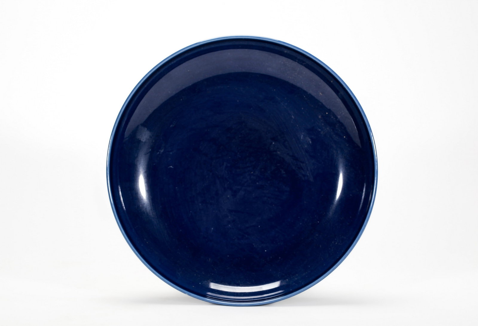 A BLUE GLAZED DISH: 清雍正霁蓝釉盘 A blue glazed dish Diam.21cm