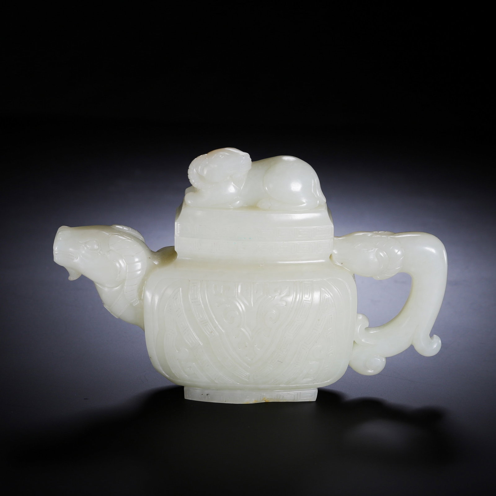 A JADE SHEEP: 和田玉羊头壶 A jade sheep Ht.10cm