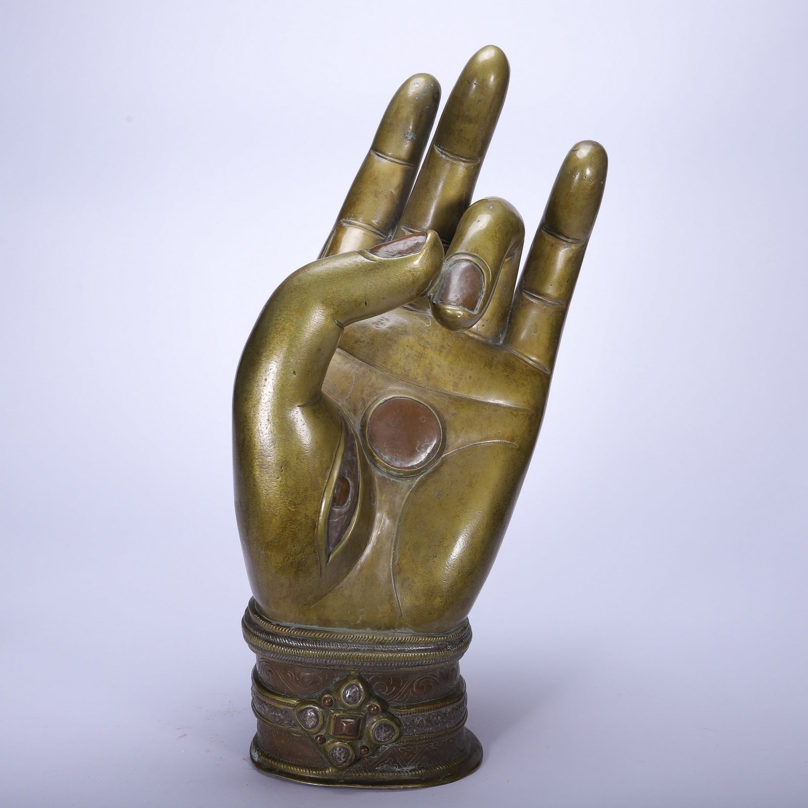 A BRONZE BUDDHA HAND: 铜佛手 A bronze Buddha hand Lg.45cm