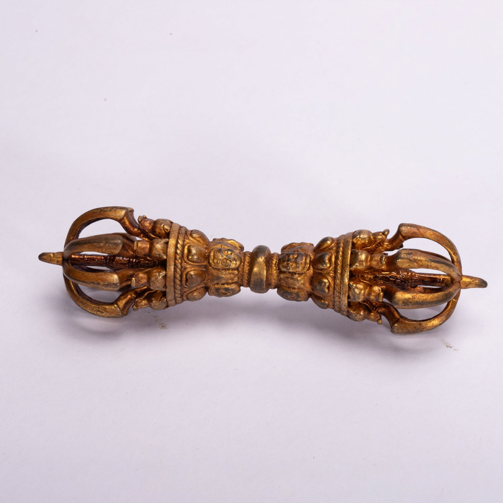 A COPPER GILDED ARTIFACT (1 of 6)