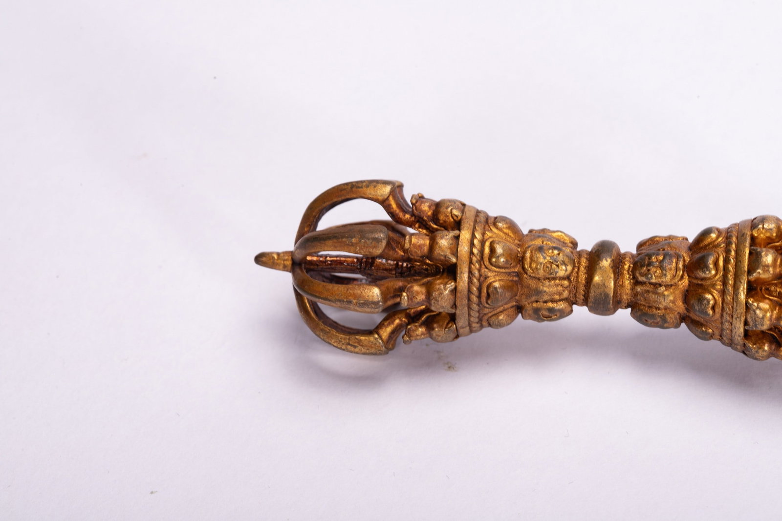 A COPPER GILDED ARTIFACT - 2