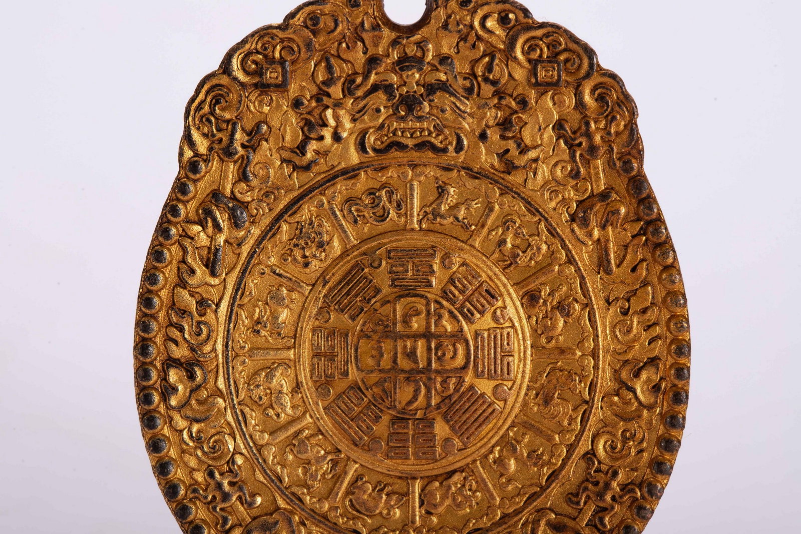 A COPPER GILDED PENDANT - 3