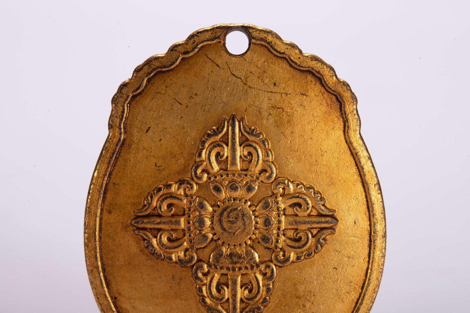 A COPPER GILDED PENDANT - 6