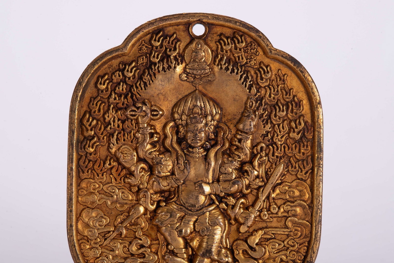 A COPPER GILDED PENDANT - 2