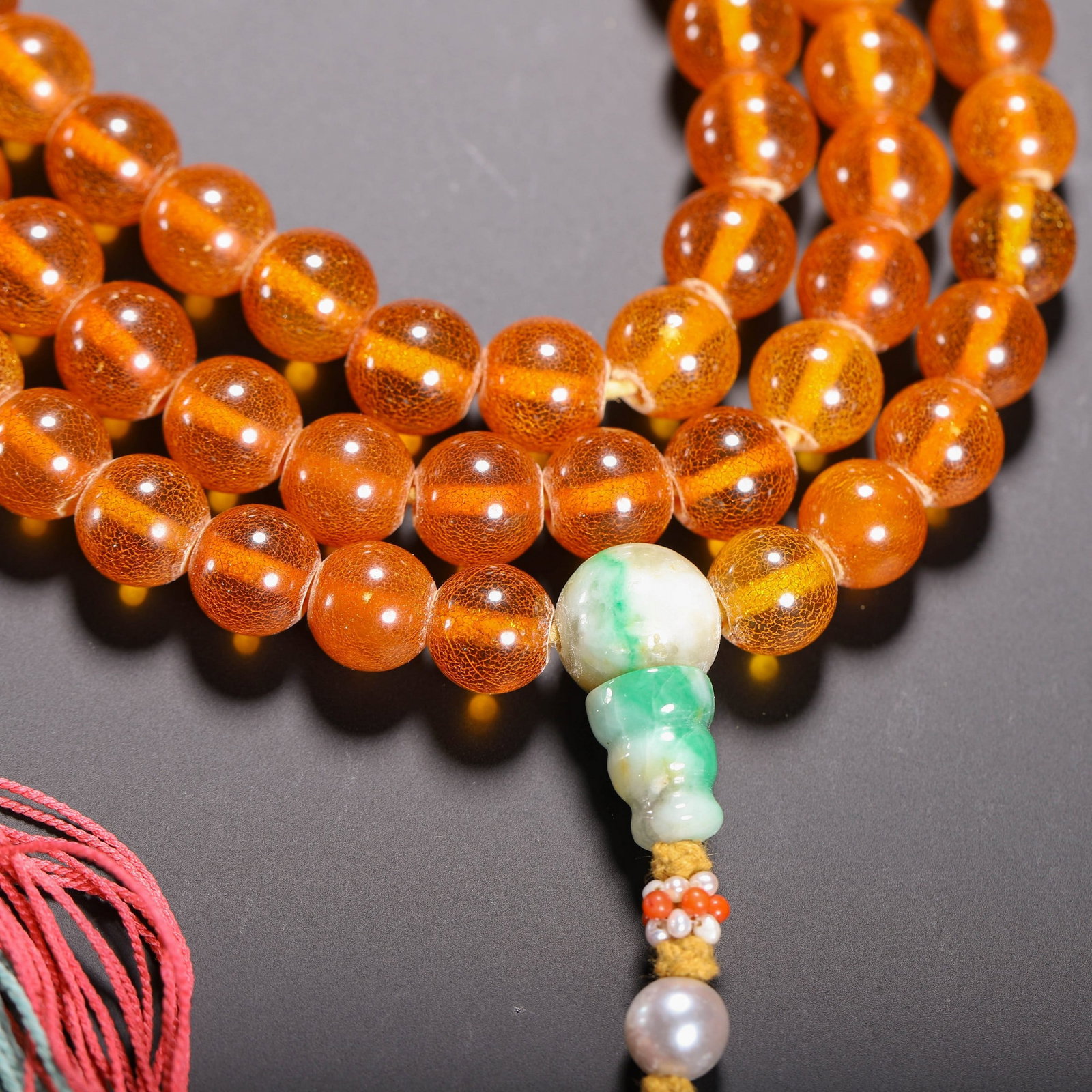 AN AMBER PRAYER BEAD - 2