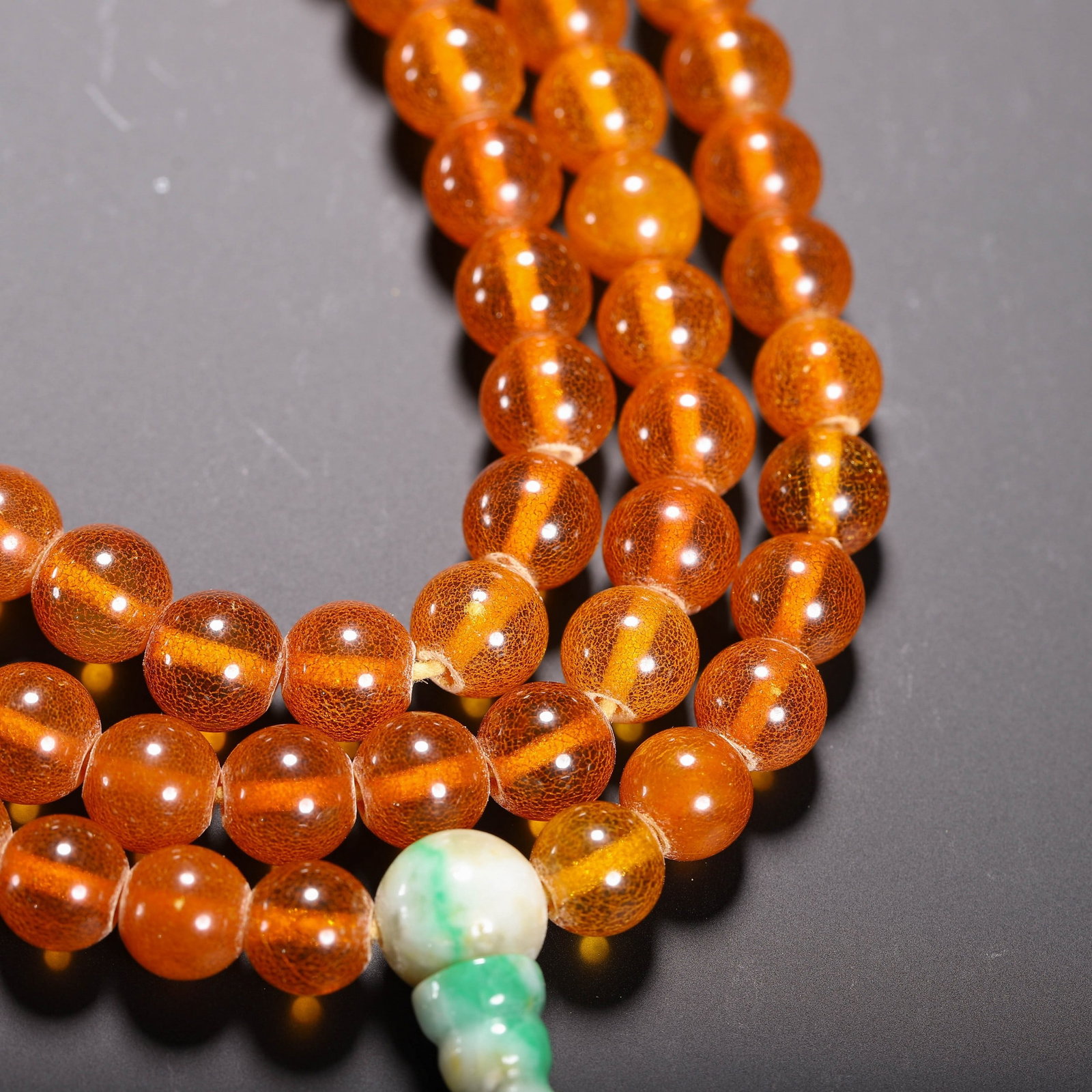 AN AMBER PRAYER BEAD - 3