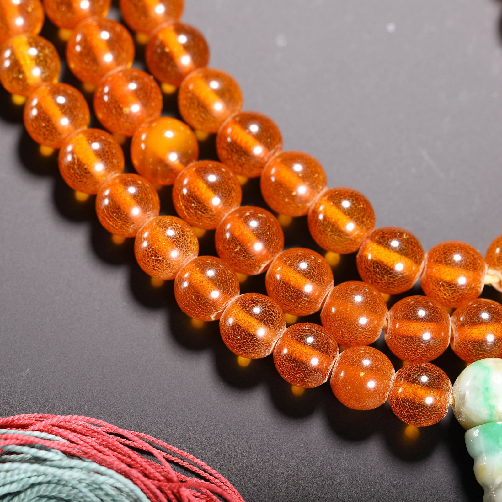 AN AMBER PRAYER BEAD - 4