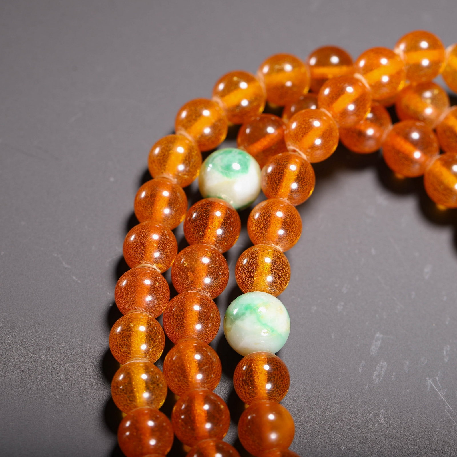 AN AMBER PRAYER BEAD - 6