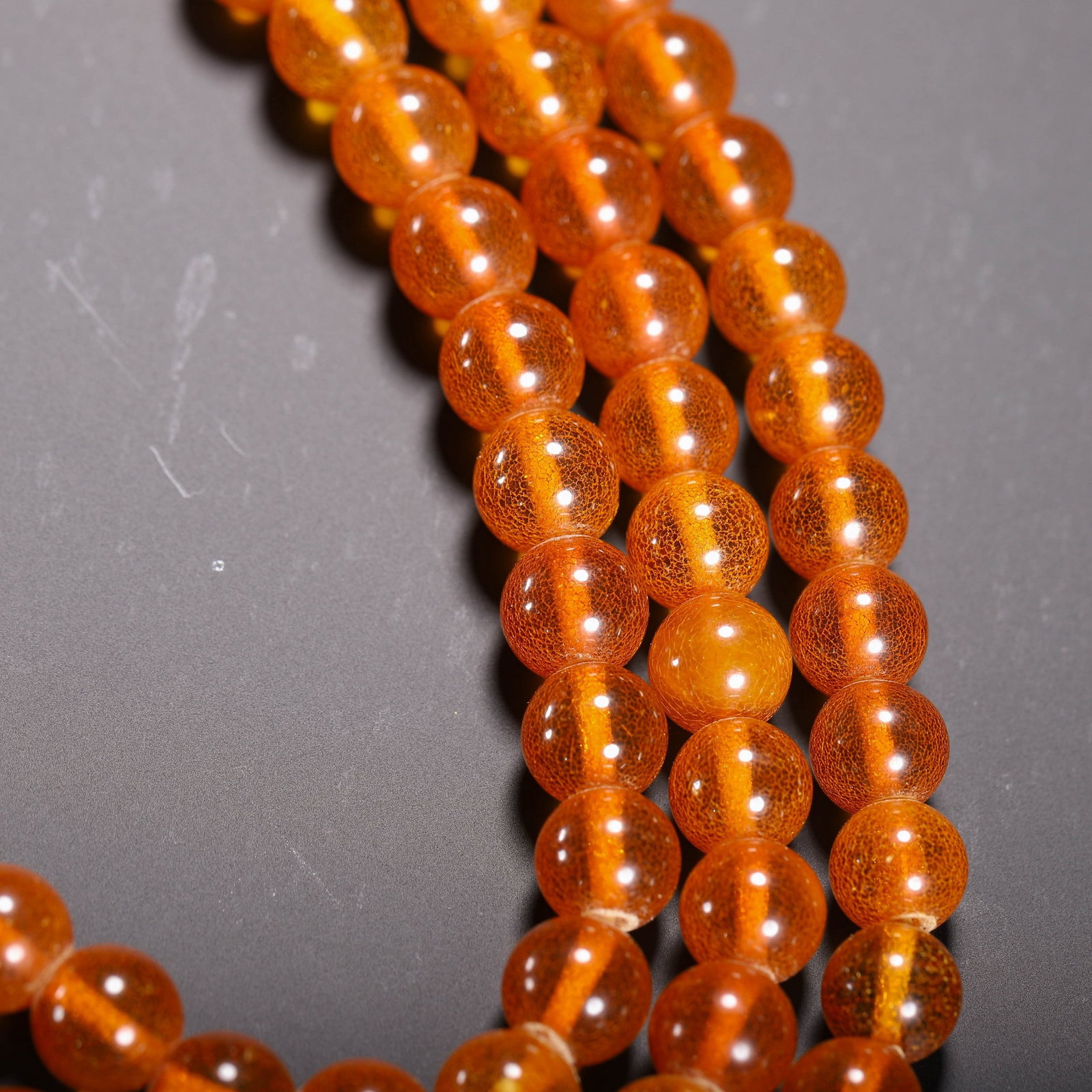 AN AMBER PRAYER BEAD - 8