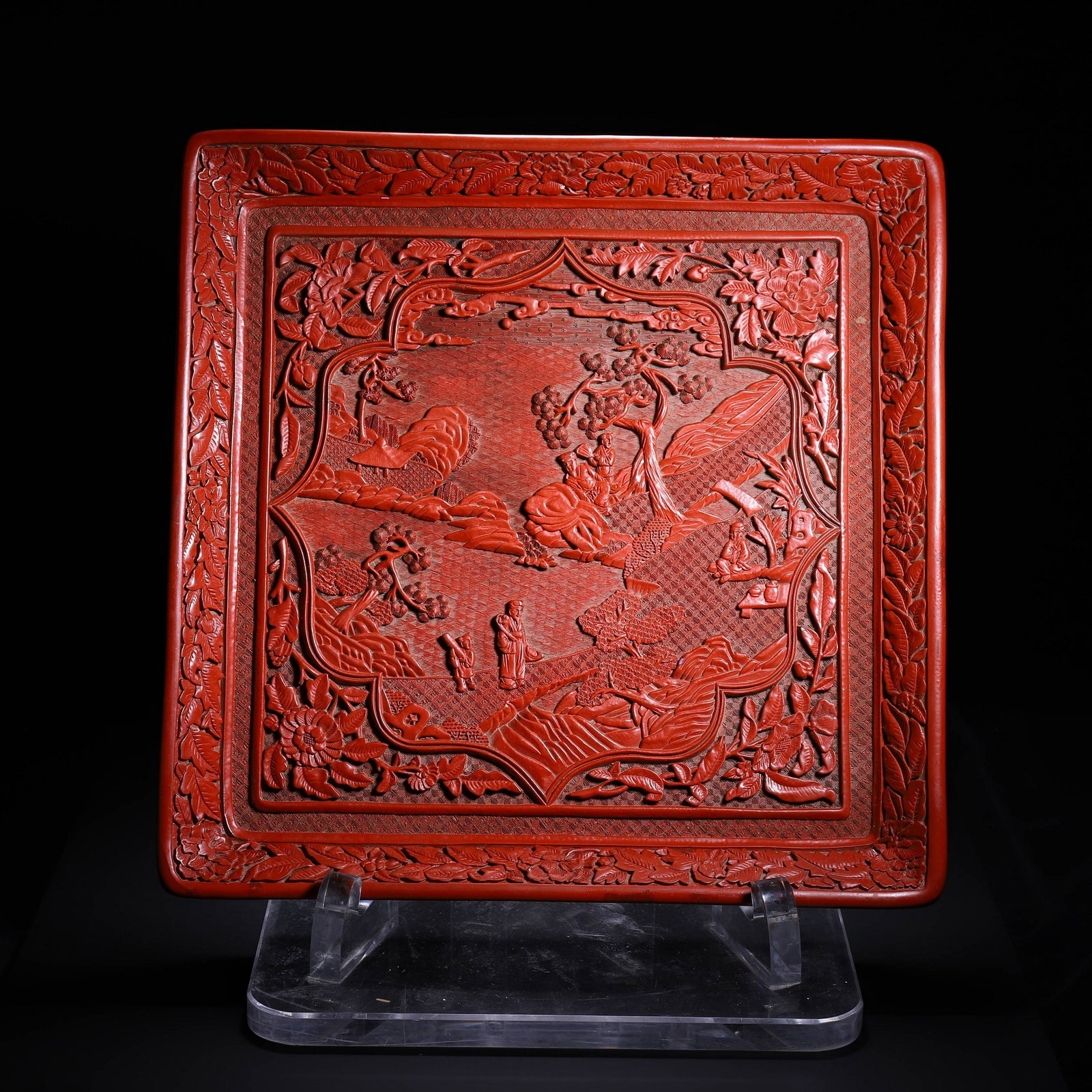 A CARVED LACQUERWARE FIGURE DISH: 剔红四方人物赏盘 A carved lacquerware figure dish Diam.30cm