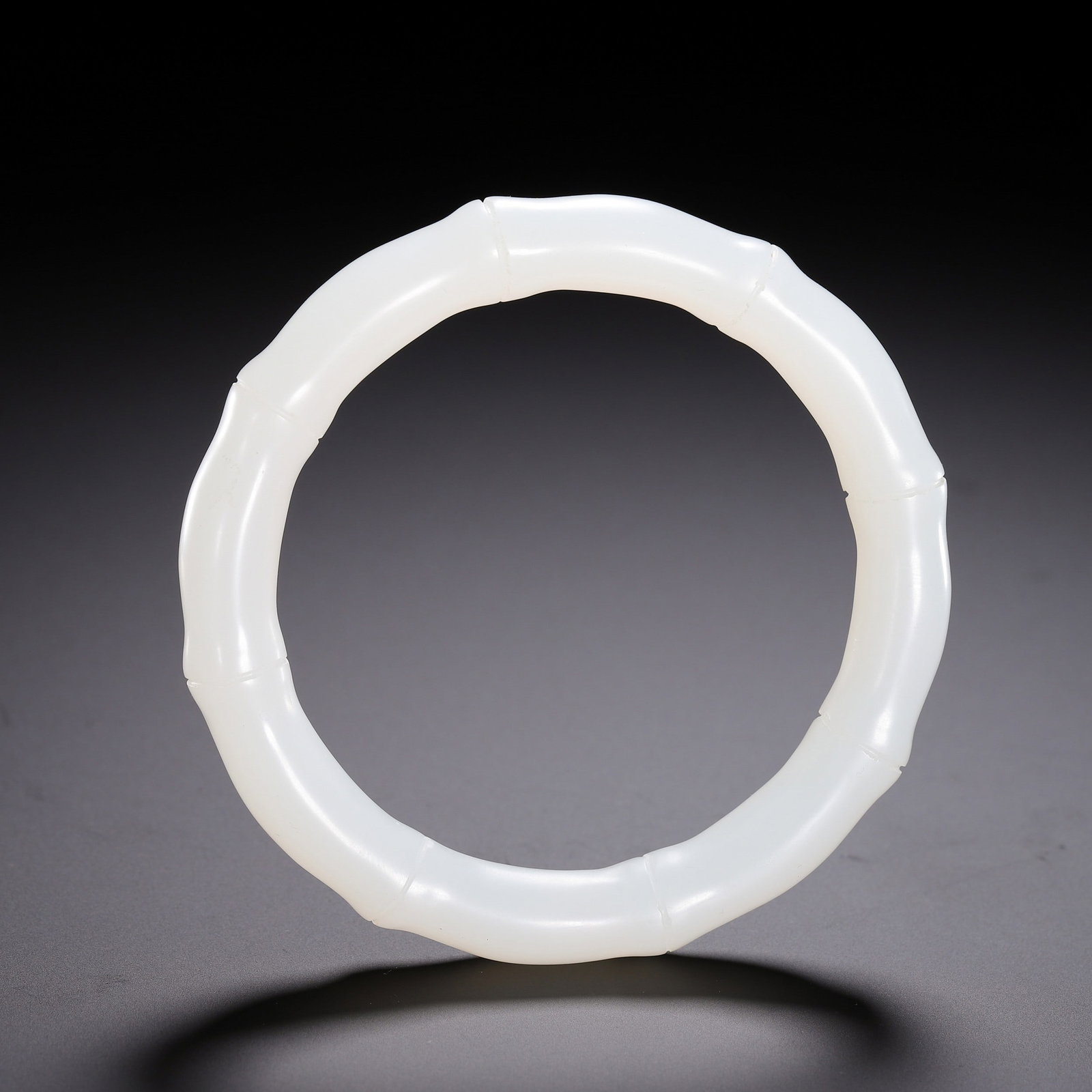 A JADE BRACELET: 白玉手镯 A jade bracelet Diam.6.1cm
