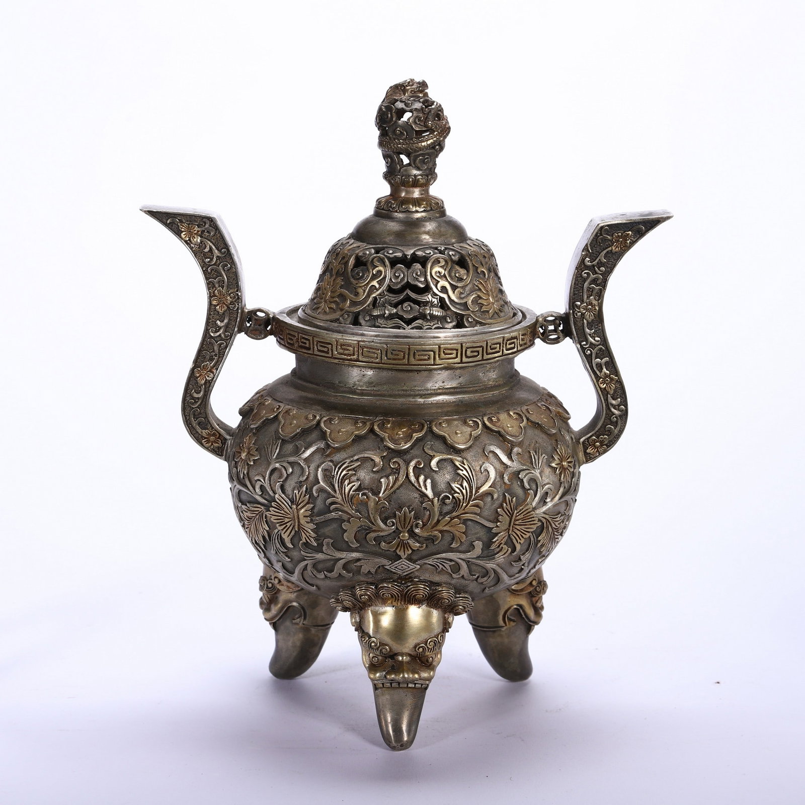 A COPPER GILDED FLORAL TRIPOD INCENSE BURNER: 铜鎏金花卉纹三足炉 A copper gilded floral tripod incense burner Diam.18.5 Ht.24cm