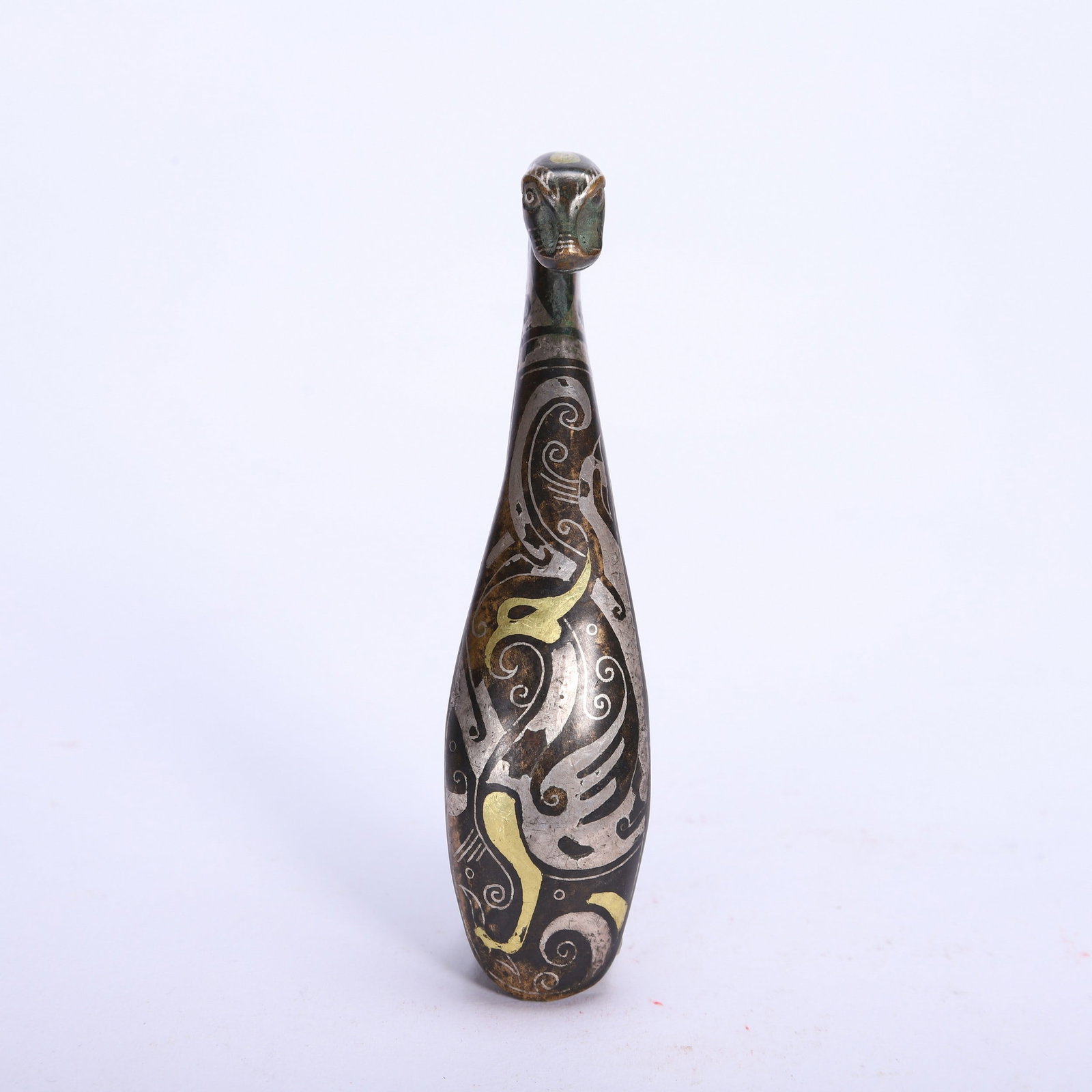 A GOLD AND SILVER BELT HOOK: 错金银带钩 A gold and silver belt hook Lg.9.5cm