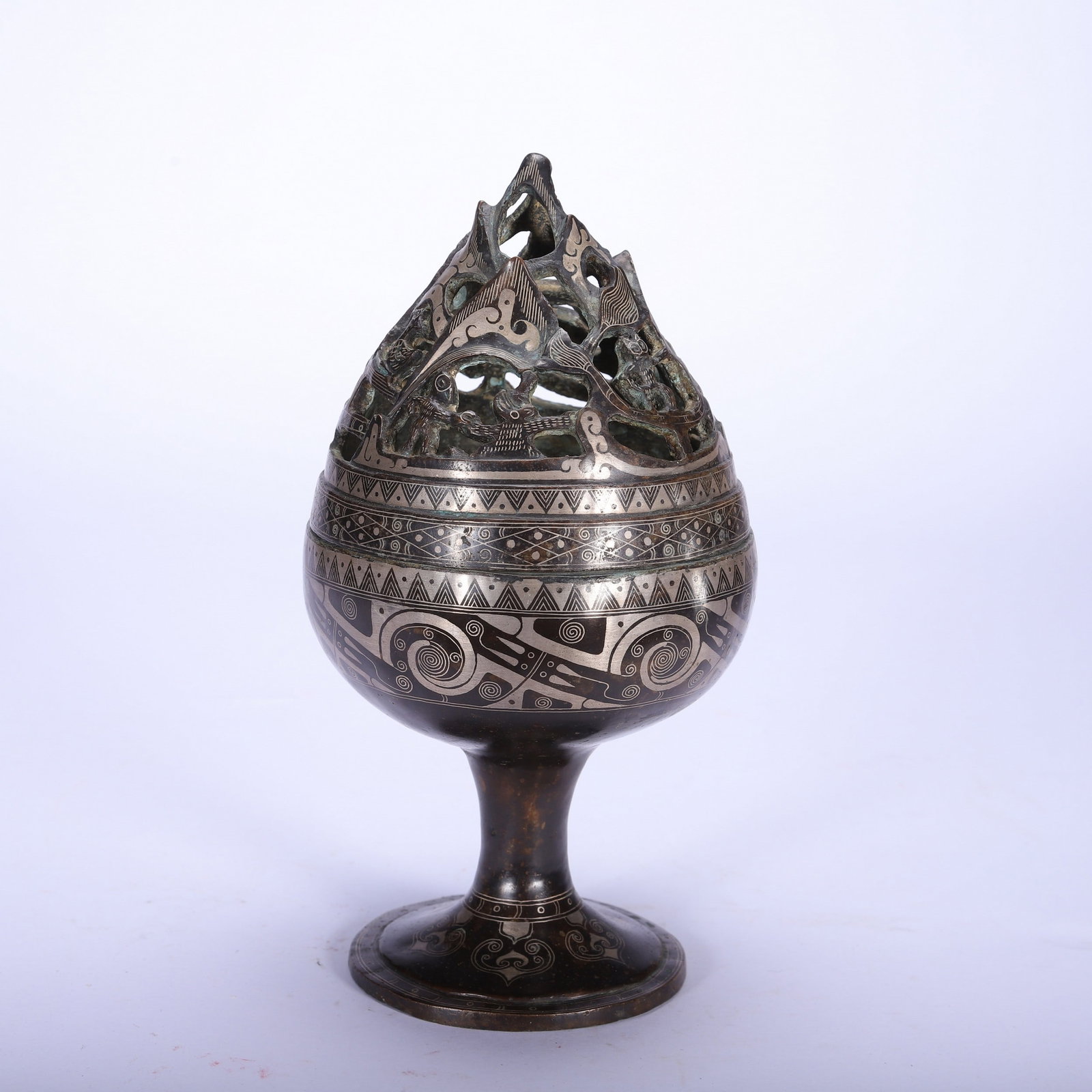 A GOLD AND SILVER INCENSE BURNER: 铜错金银博山炉 A gold and silver incense burner Ht.21cm