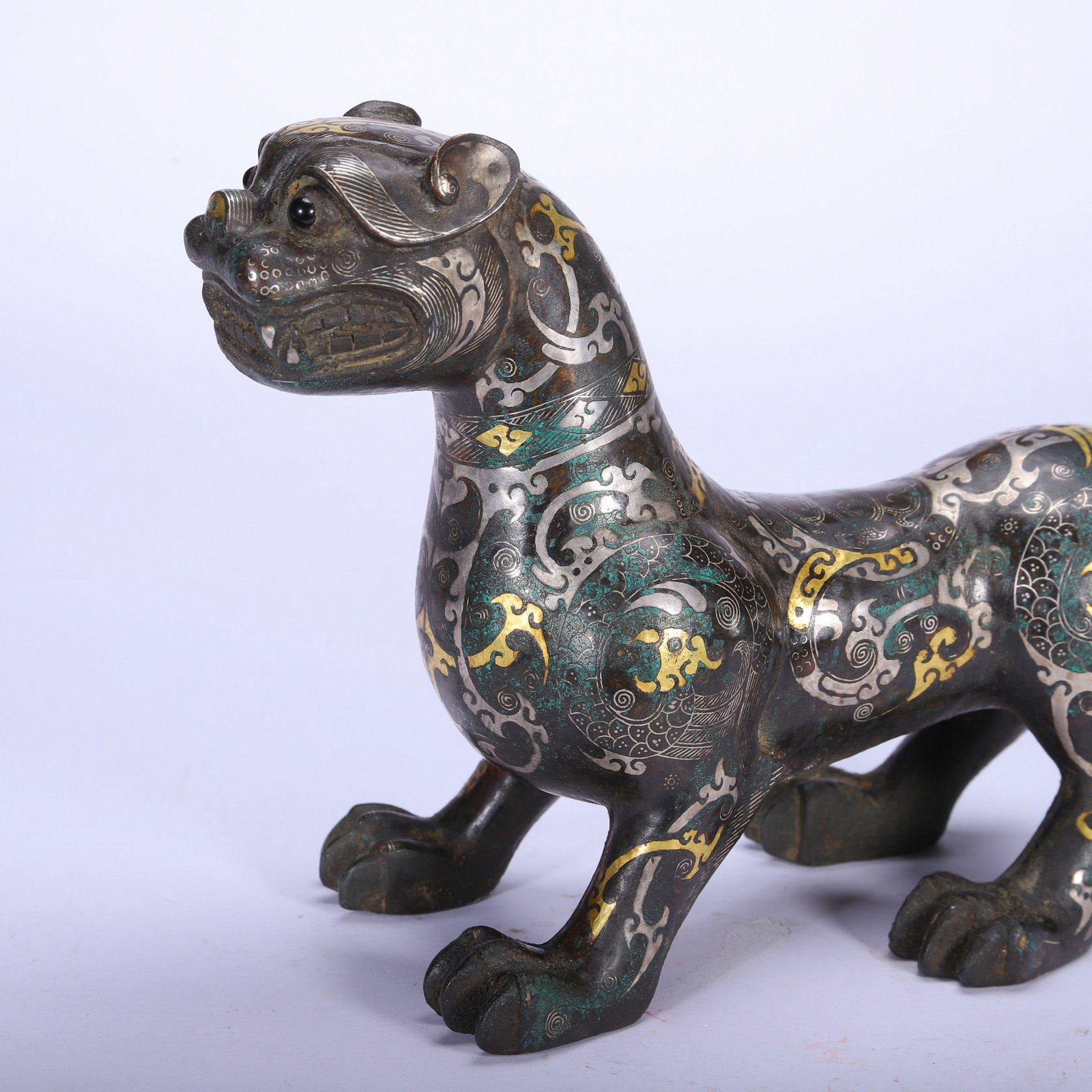 A COPPER GOLD AND SILVER BEAST - 2