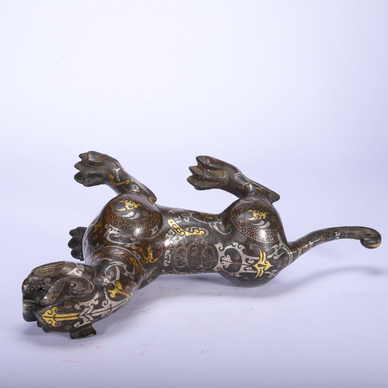 A COPPER GOLD AND SILVER BEAST - 3