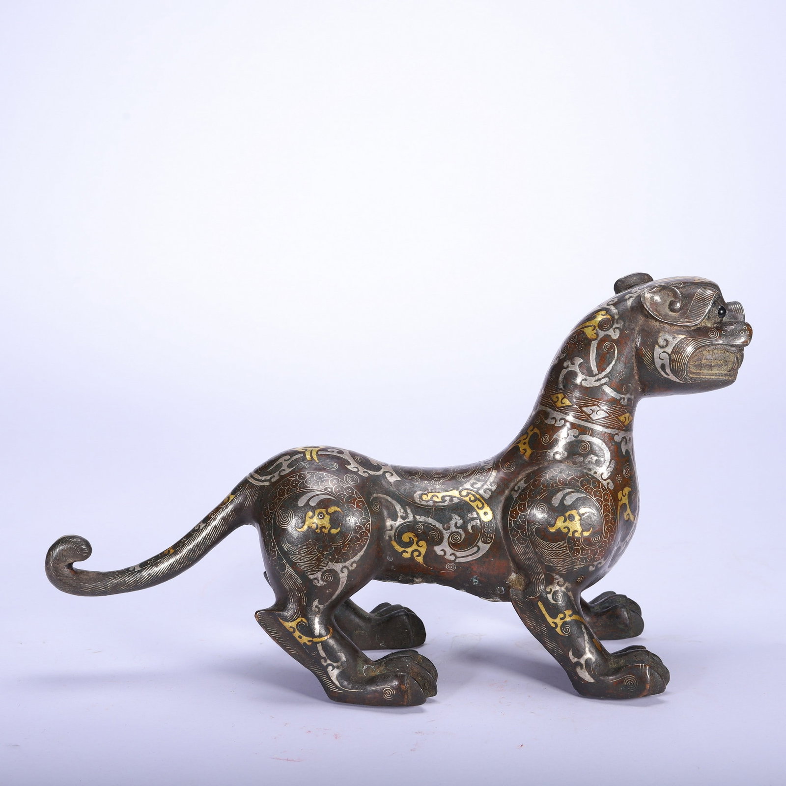 A COPPER GOLD AND SILVER BEAST - 5