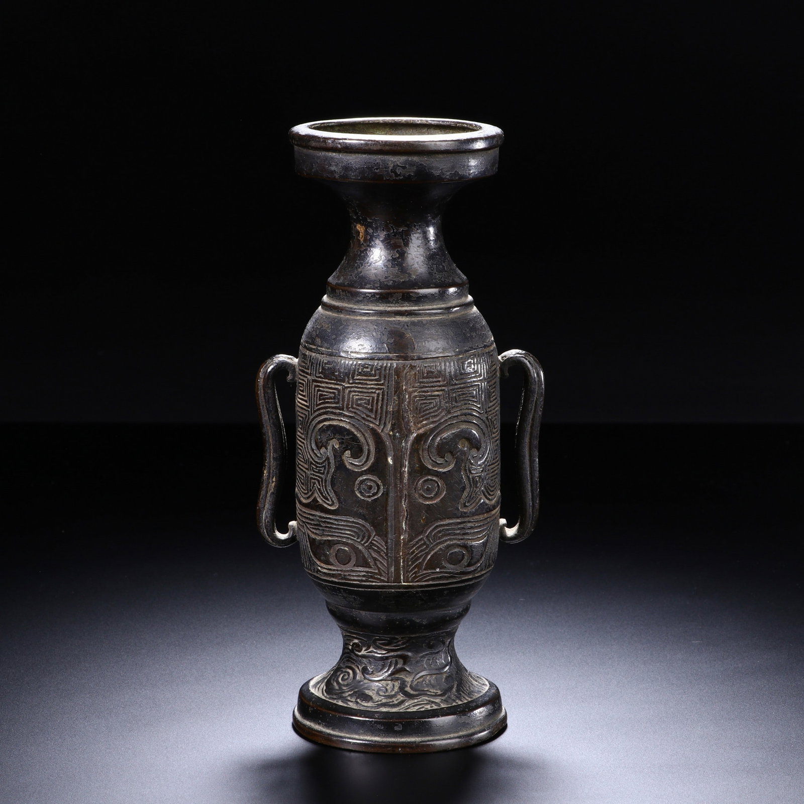 A COPPER BEAST VASE: 铜饕餮纹双耳瓶 A copper beast vase Lg.8cm Ht.15.5cm