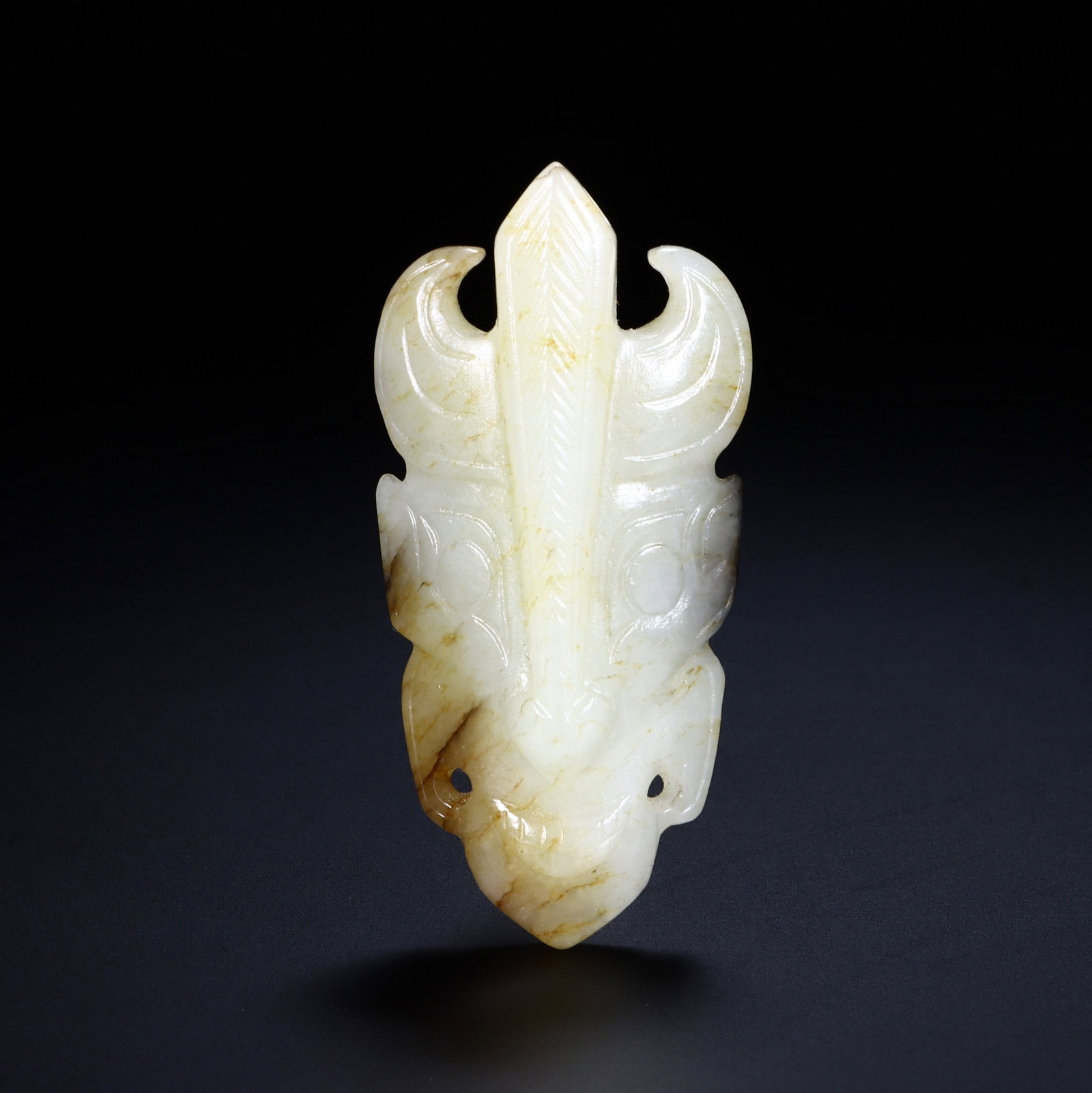 A JADE PENDANT: 玉饕餮纹挂件 A jade pendant 6x2.9cm