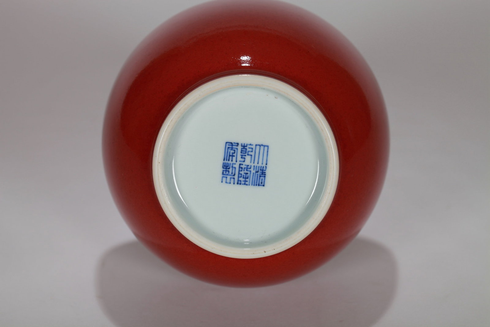 A RED GLAZED VASE - 10