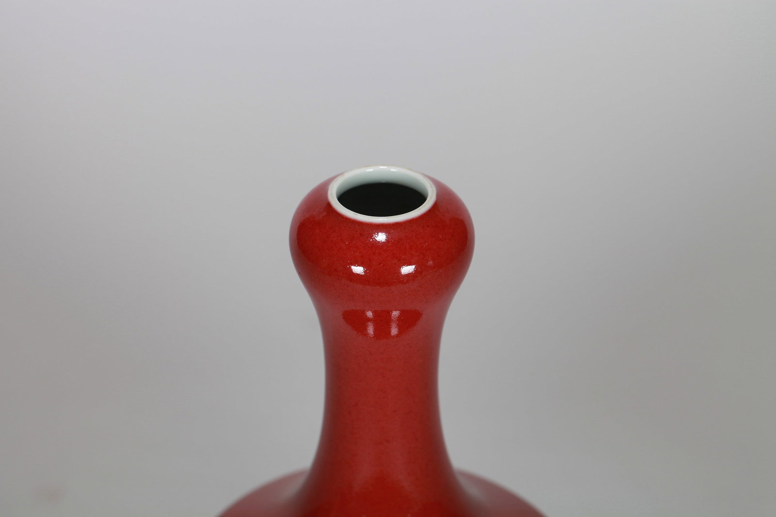 A RED GLAZED VASE - 6