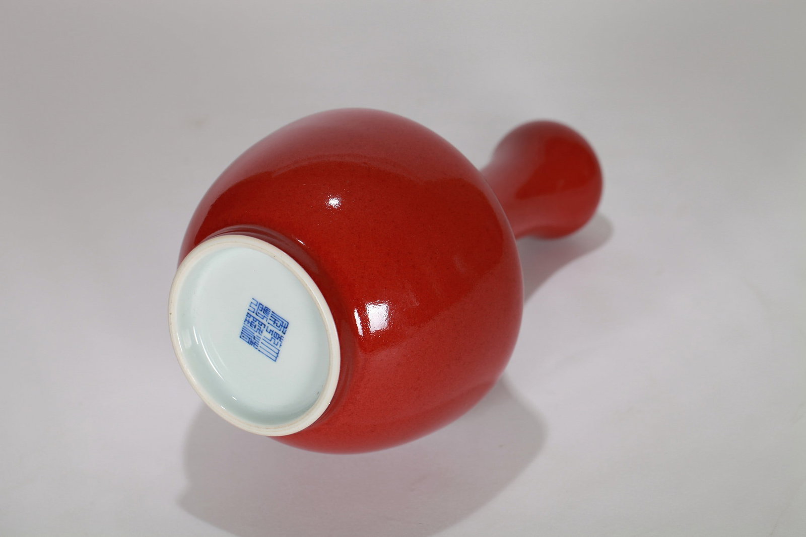 A RED GLAZED VASE - 8