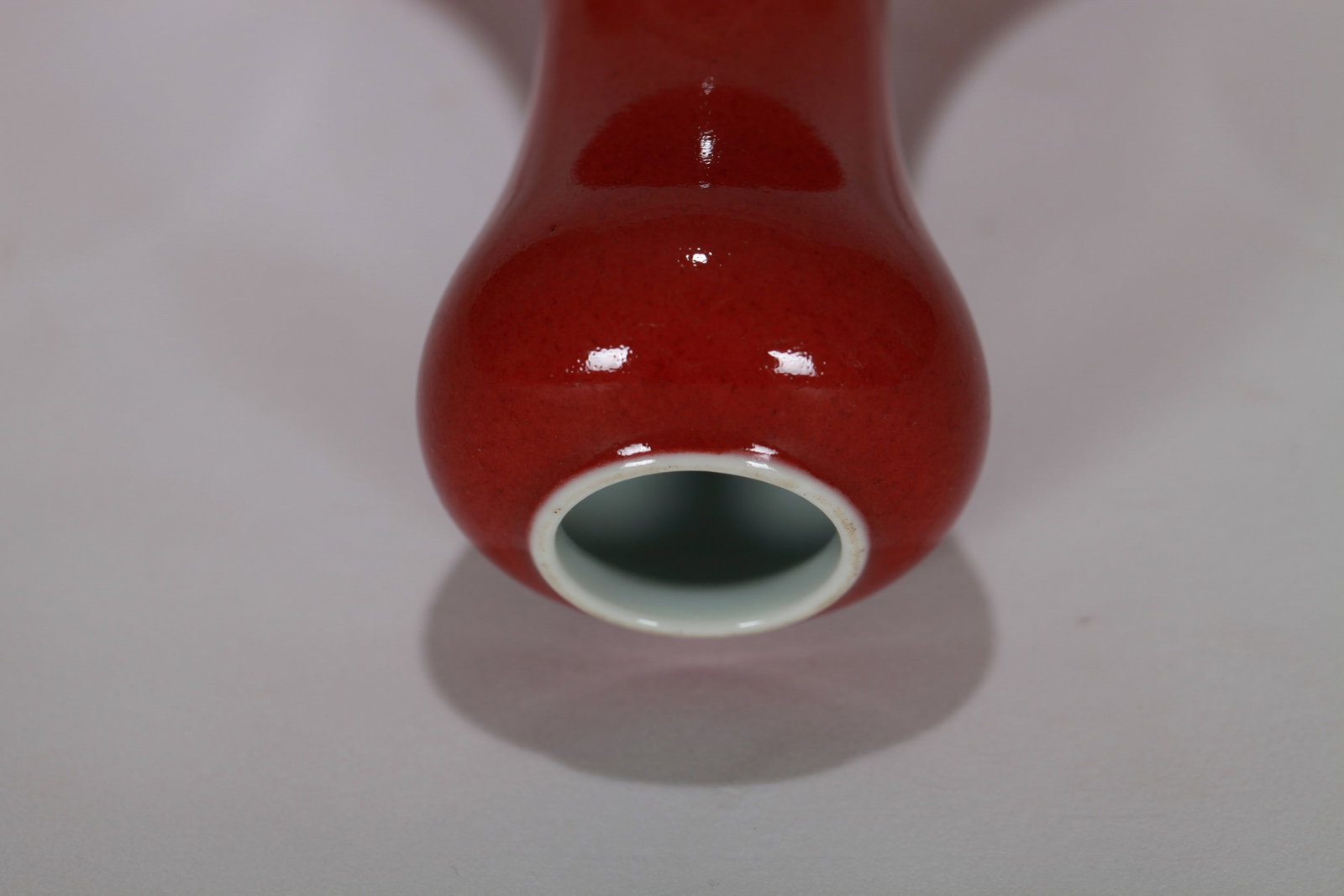 A RED GLAZED VASE - 9