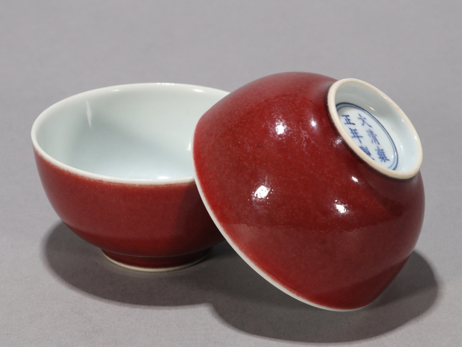 A PAIR OF RED GLAZED BOWLS: 雍正 祭红釉茶圆一对 A pair of red glazed bowls Diam.7cm Ht.4cm