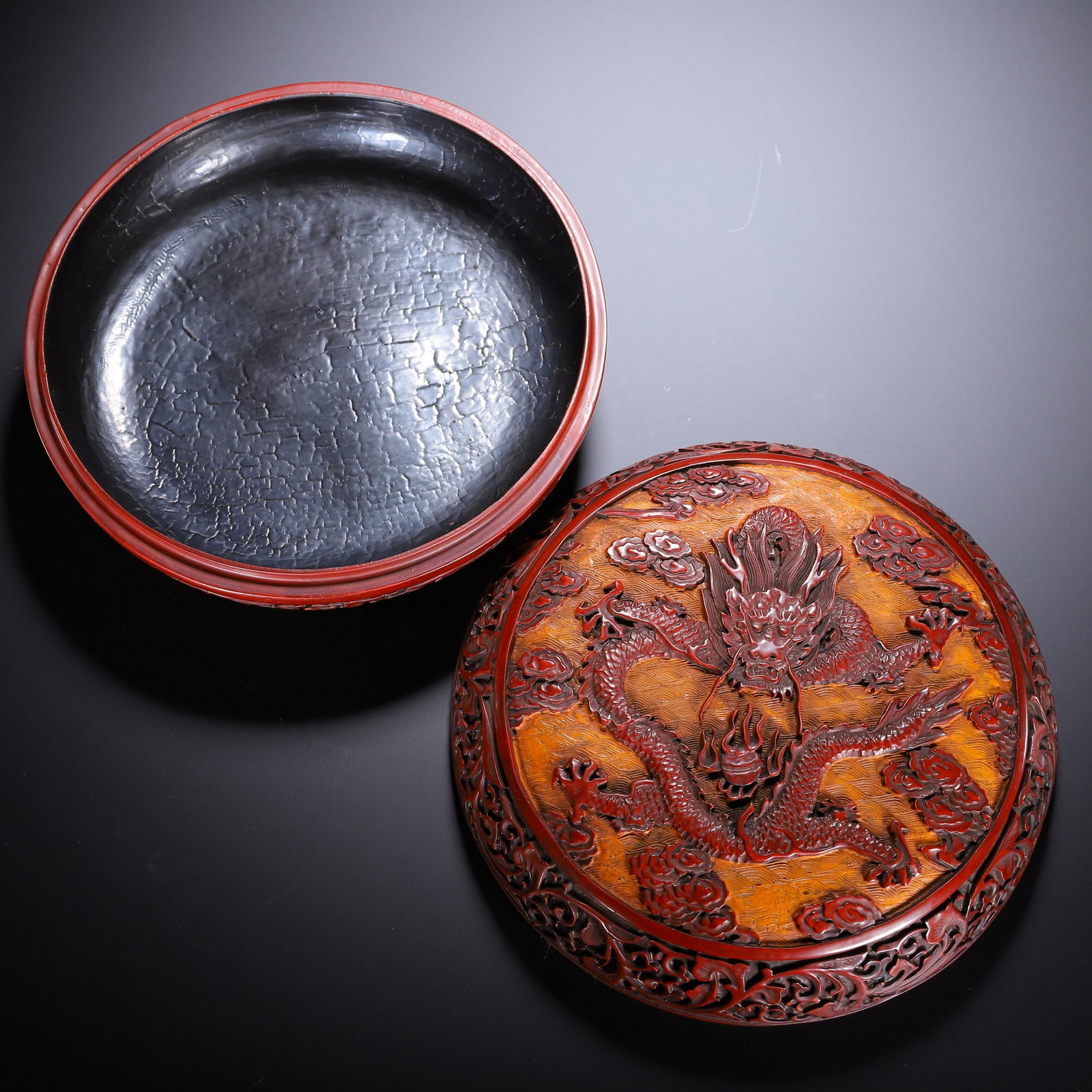 A CARVED LACQUERWARE BOX: 清 剔红龙纹捧盒 A carved lacquerware box 19.5×19.5×7.5cm