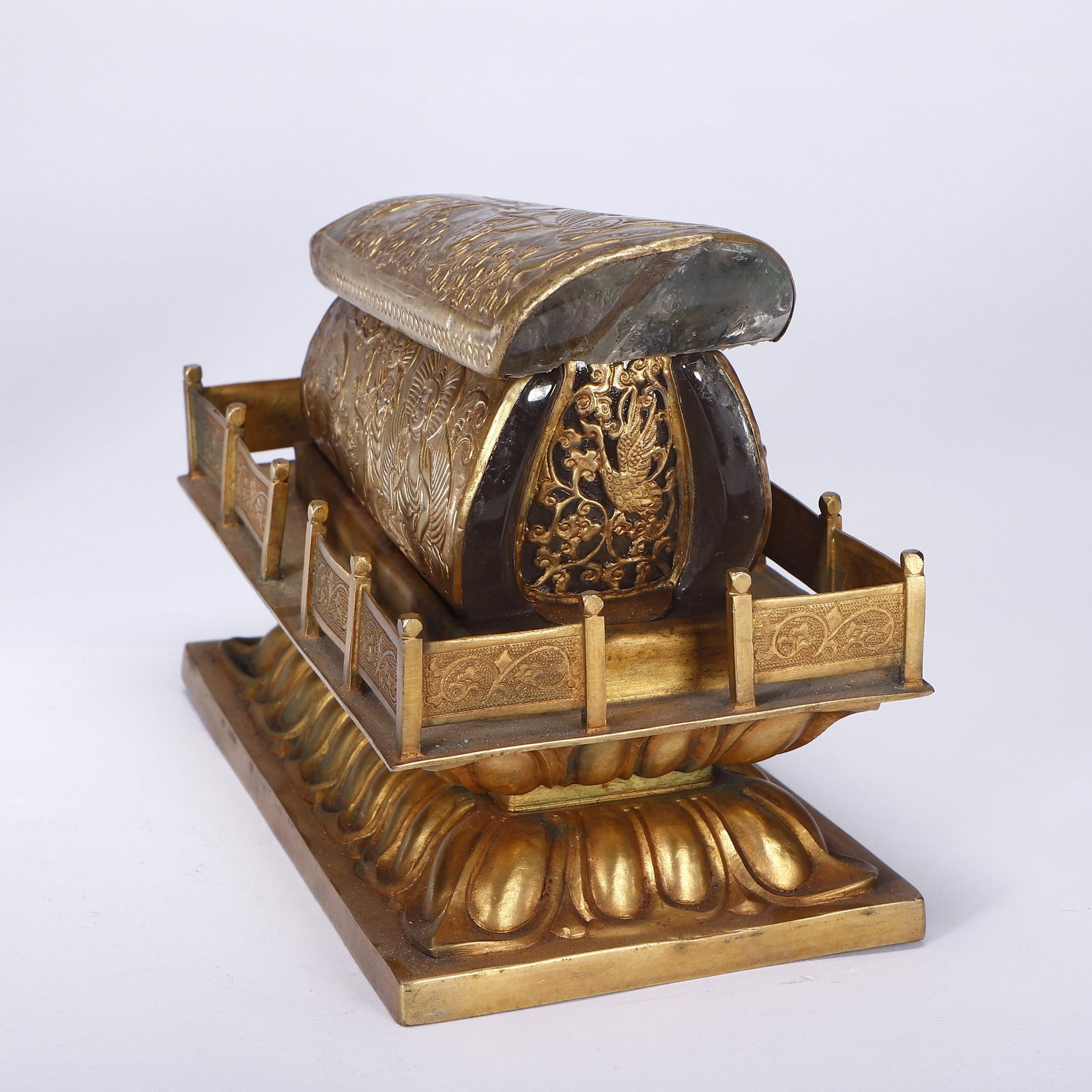 A COPPER GILDING CRYSTAL RELIC COFFIN: 清 铜鎏金水晶舍利棺 A copper gilding Crystal Relic Coffin Lg.17cm