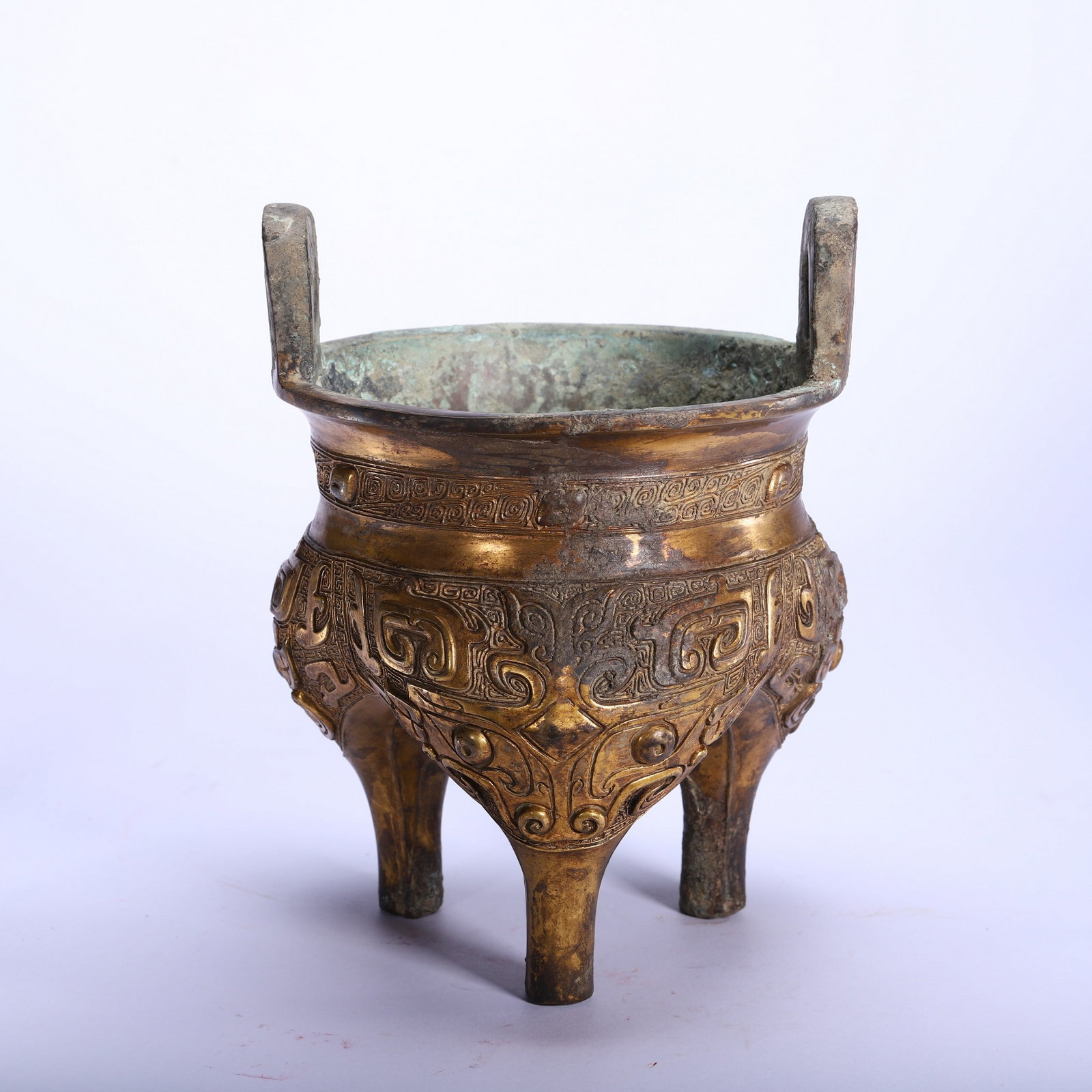A COPPER GILDING INCENSE BURNER: 清 铜鎏金香炉 A copper gilding incense burner Ht.21cm