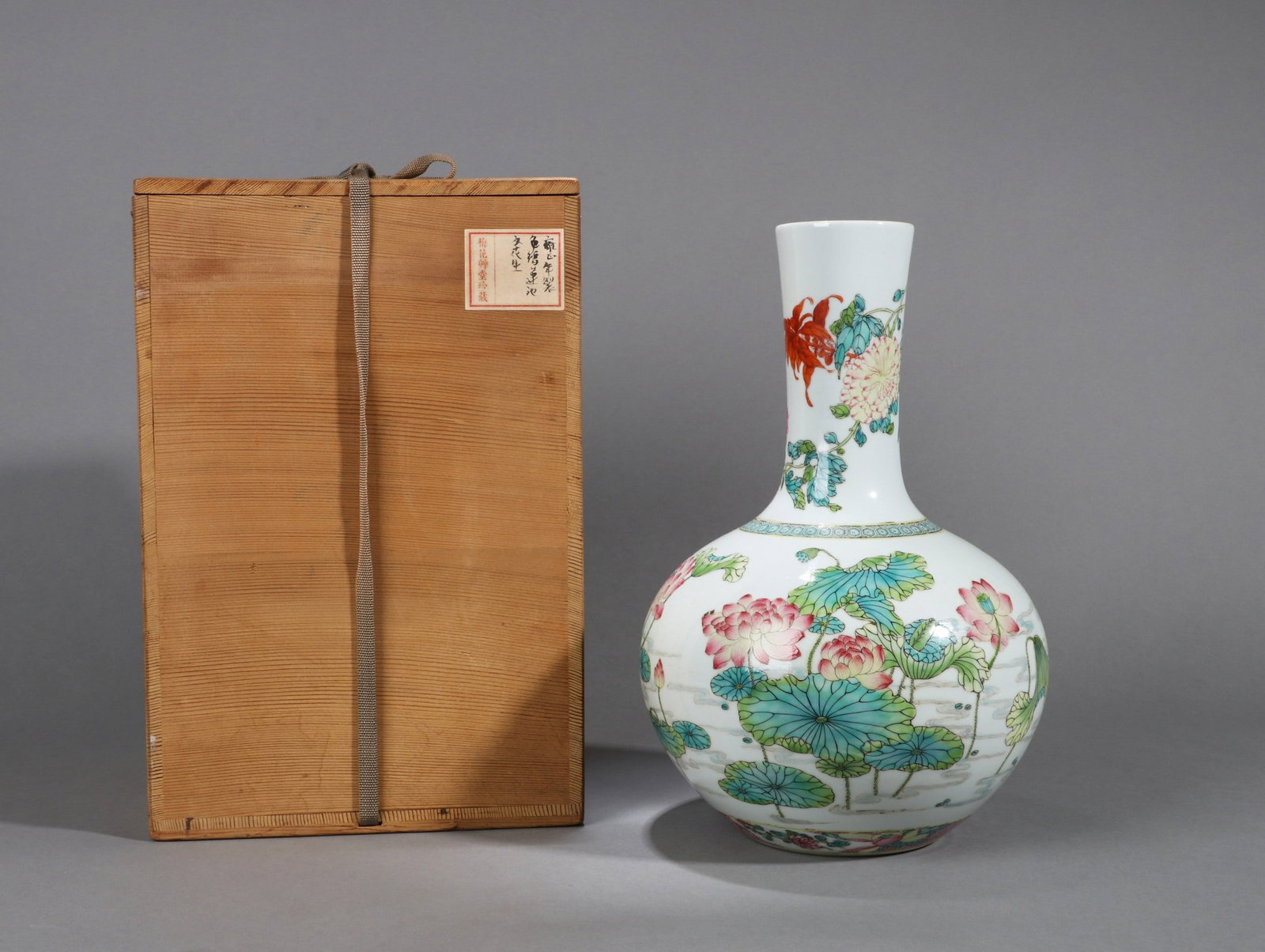 A SMALL FAMILLE-ROSE LOTUS VASE: 雍正 粉彩荷塘图小天球瓶 A small famille-rose lotus vase Ht.33cm