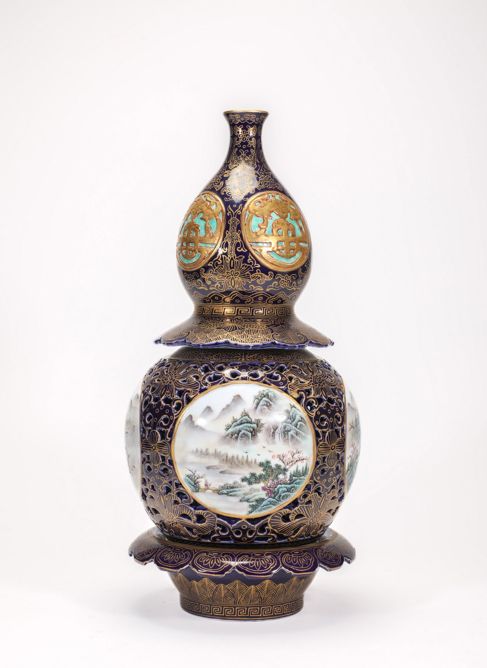 A BLUE-GLAZED FAMILLE-ROSE FLORAL DOUBLE-GOURD REVOLVING VASE: 清乾隆霁蓝描金粉彩葫芦转心瓶 A blue-glazed famille-rose floral double-gourd revolving vase Diam.20cm Ht.40cm