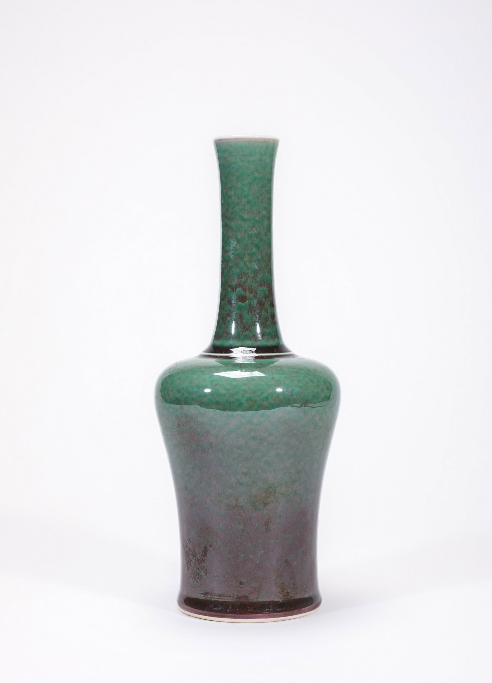 A GREEN-GLAZED ZUN: 清康熙郎绿釉摇铃尊 A green-glazed zun Diam.9cm Ht.21cm