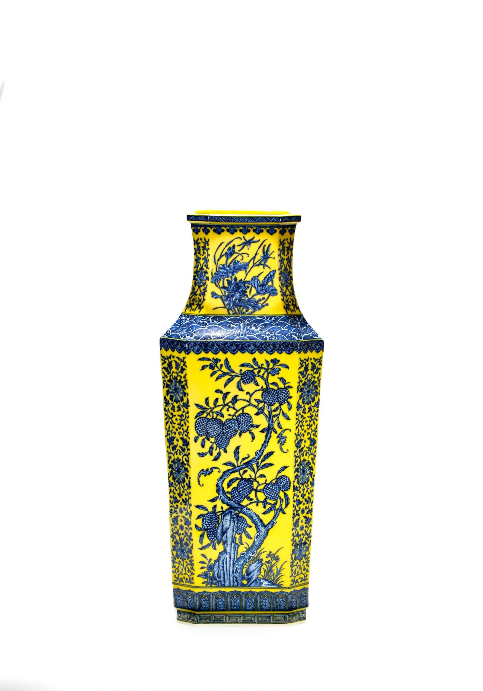 A LARGE YELLOW-GROUND BLUE AND WHITE FLOWER AND FRUIT VASE: 清乾隆黄地青花四面花果纹大瓶 A large yellow-ground blue and white flower and fruit vase Ht.60cm