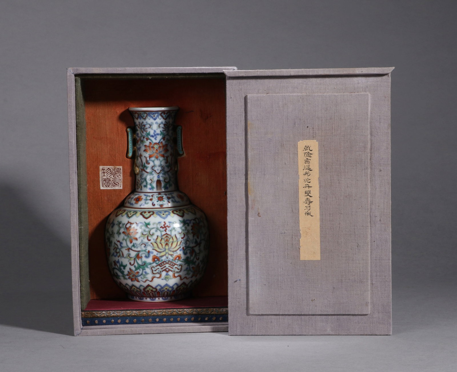 A DOUCAI FLORAL VASE: 乾隆 斗彩花卉双寿耳瓶 A doucai floral vase Ht.20cm