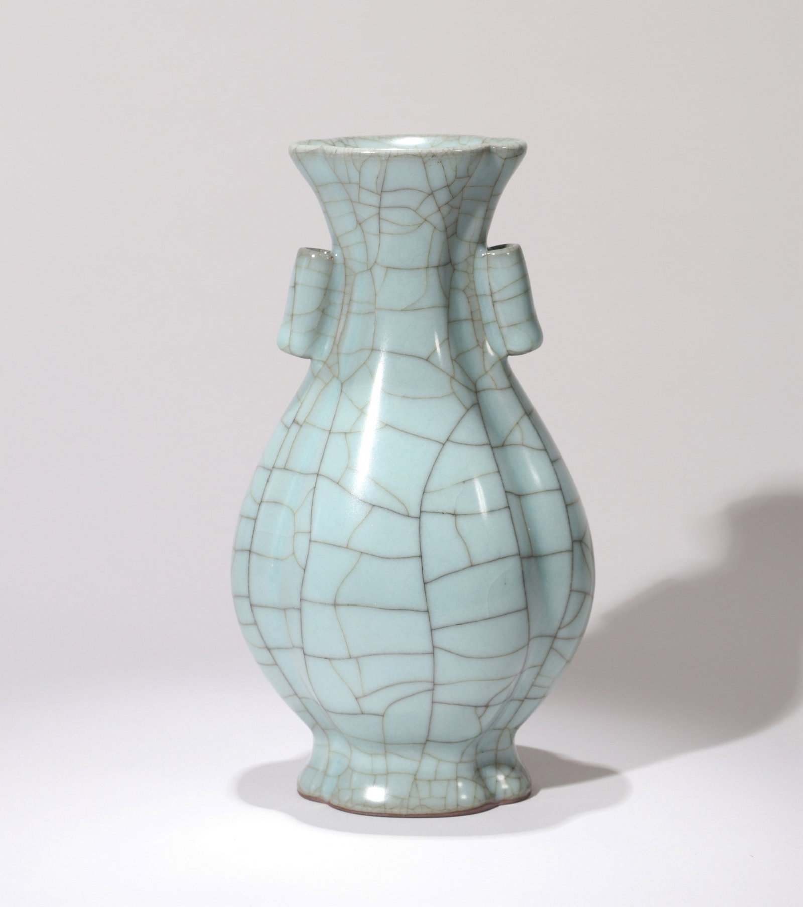 A GUAN VASE: 宋 官窑葵口贯耳瓶 A Guan vase Ht.20cm