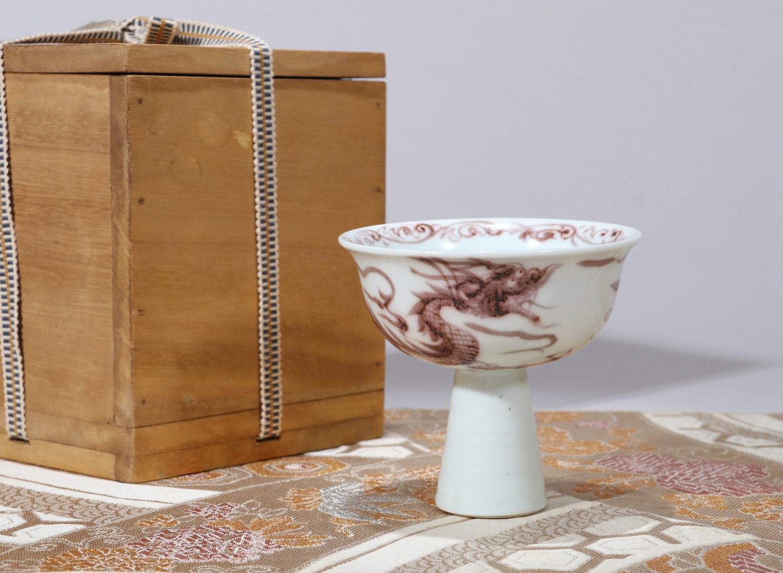 A COPPER-RED DRAGON STEM BOWL: 元 釉里红龙纹高足碗 A copper-red dragon stem bowl Ht.9cm