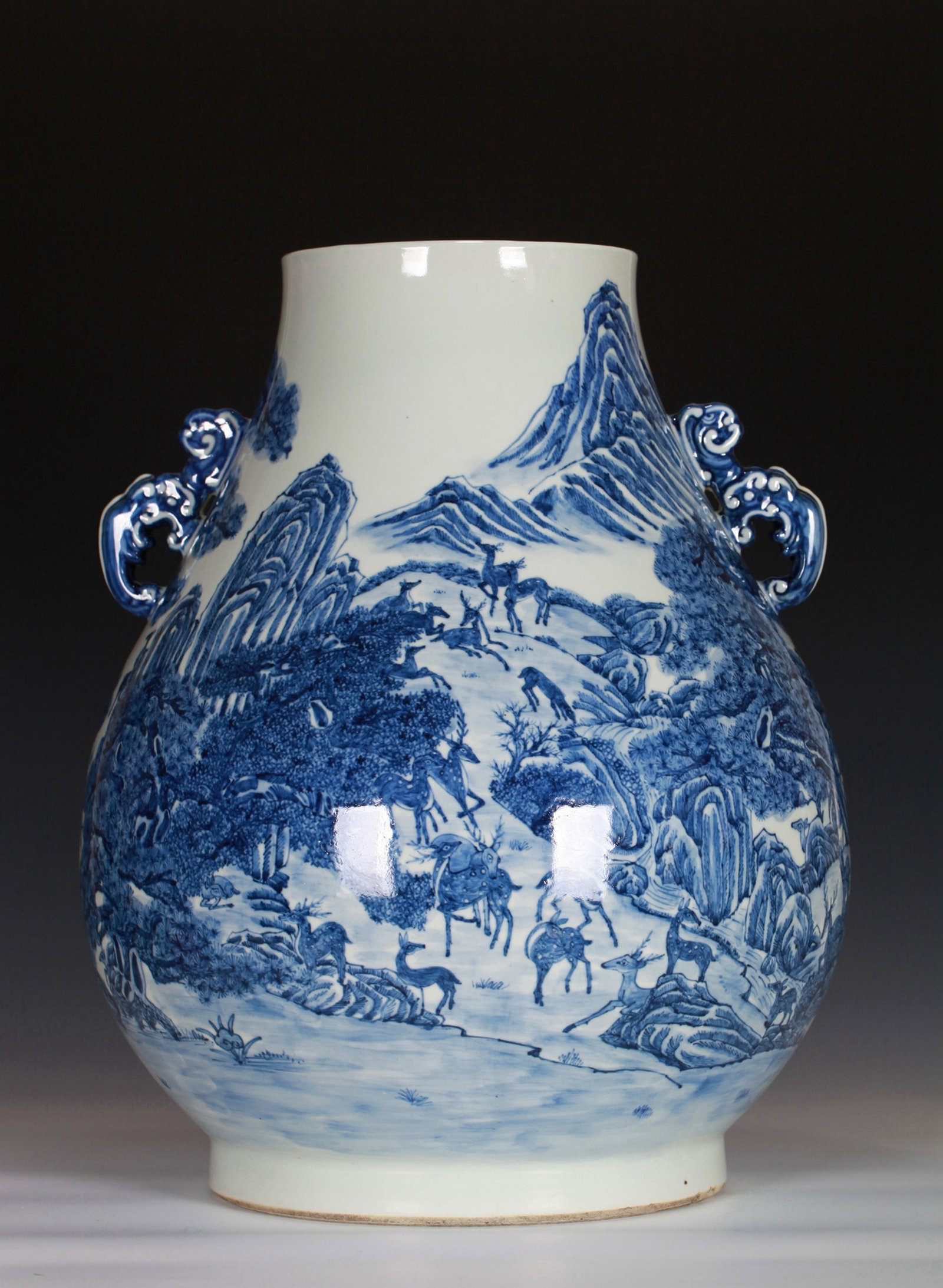 A BLUE AND WHITE DEER ZUN: 清 青花百鹿尊 A blue and white deer zun Ht.46CM