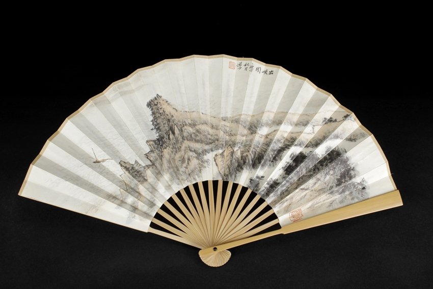 AN INK ON PAPER 'LANDSCAPE' FAN: Fan leaf painted with a small boat sailing out of the river gorge, with artist seal mark on top and right side. Dimensions: L: 9 1/4 in (23.5 cm) W: 16 3/8 in (41.6 cm)