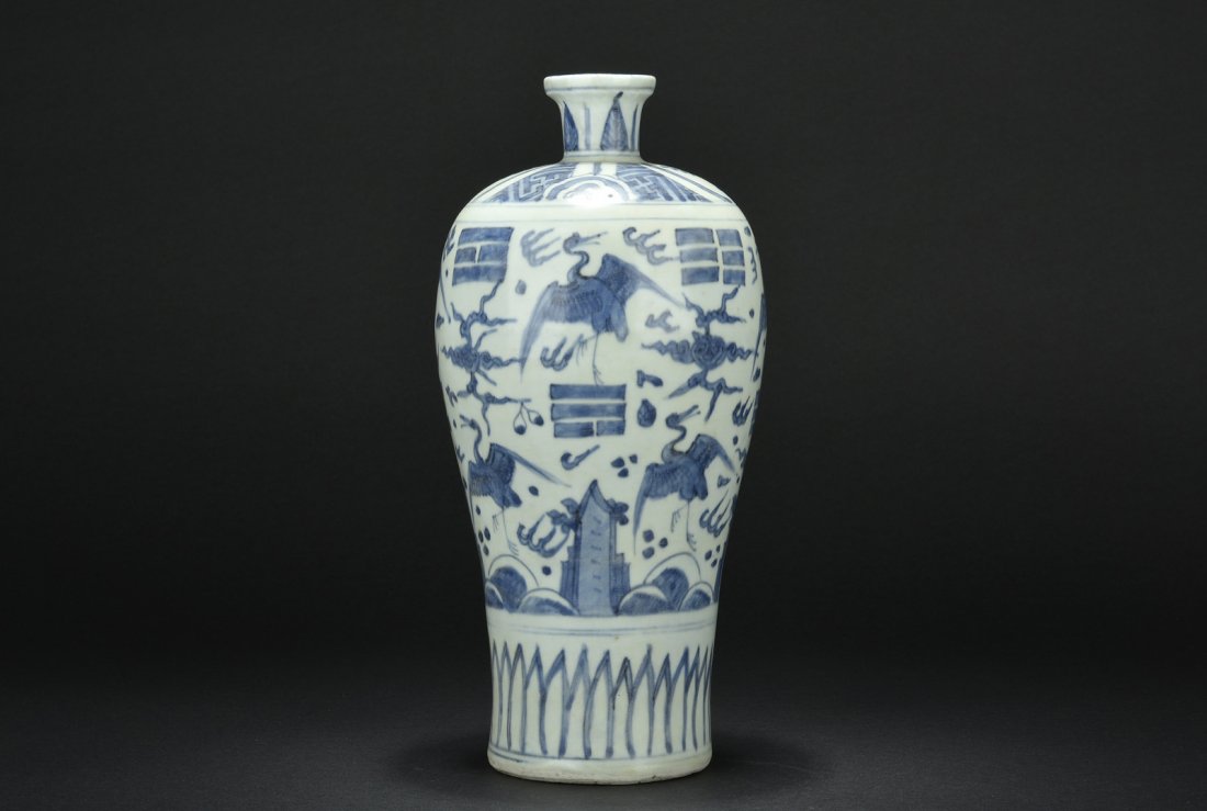 BLUE AND WHITE BOTTLE VASE, MEIPING: The tall vase with elegant body depicts cranes and other auspicious items amidst sky, between lappet and banana leaf patterns. Ming Dynasty period. H: 12 7/8 in (32.7 cm) W: 5 3/4 in (14.6 cm)